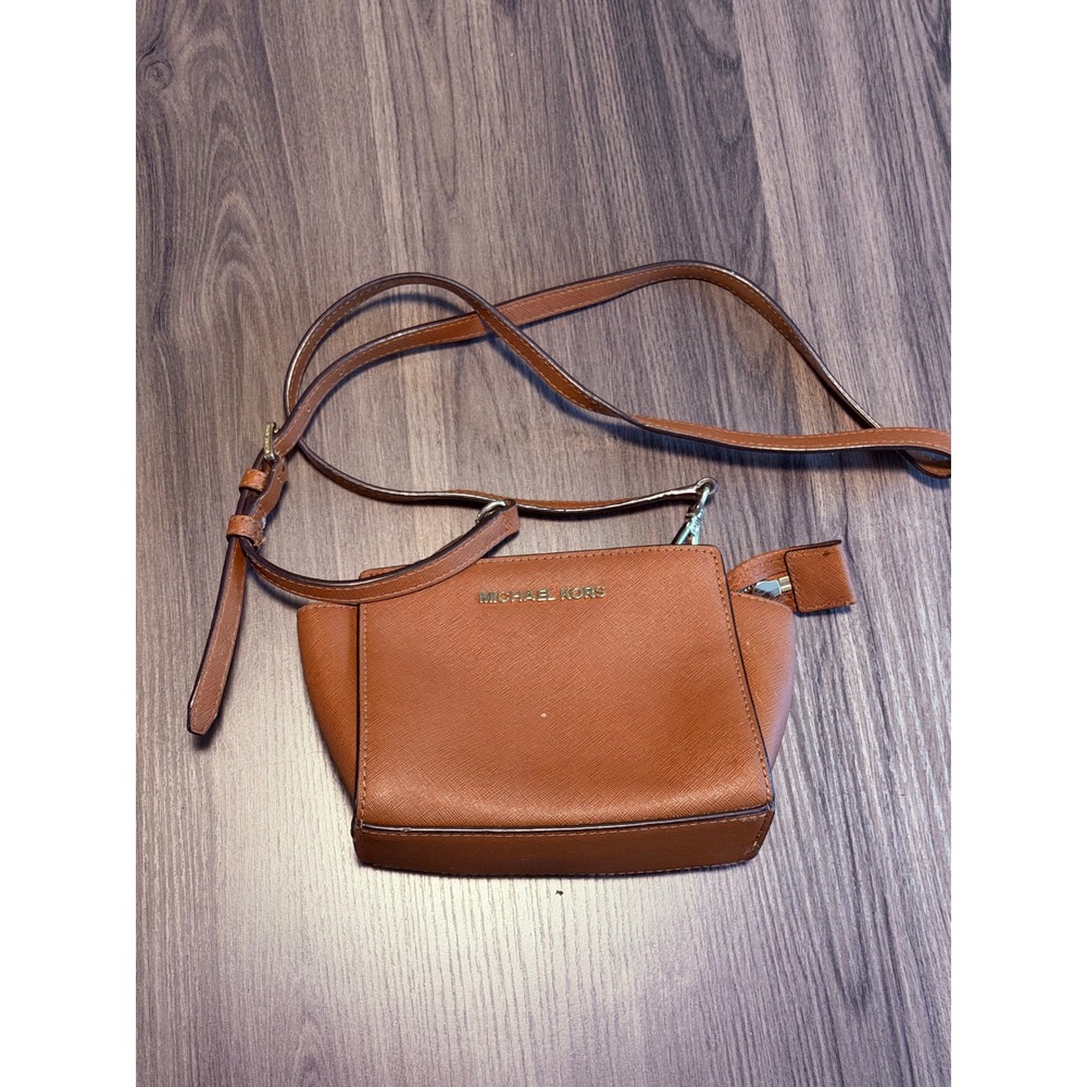 Michael Kors saffiano leather crossbody in cognac/brown with gold-tone hardware.